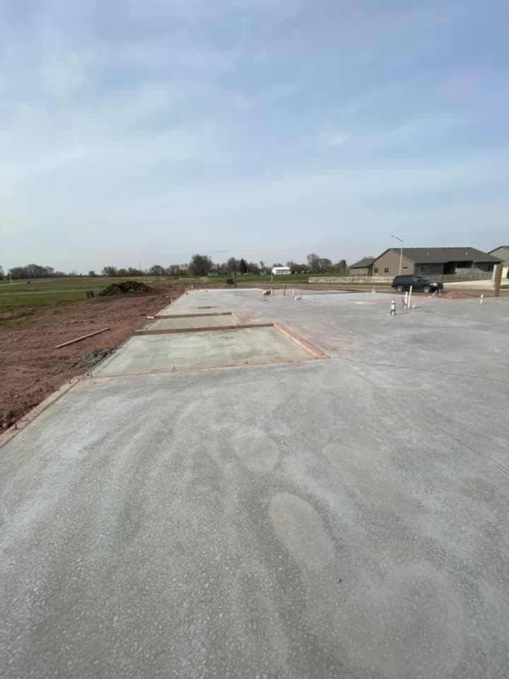 Wide finished flatwork stretching across a new development
