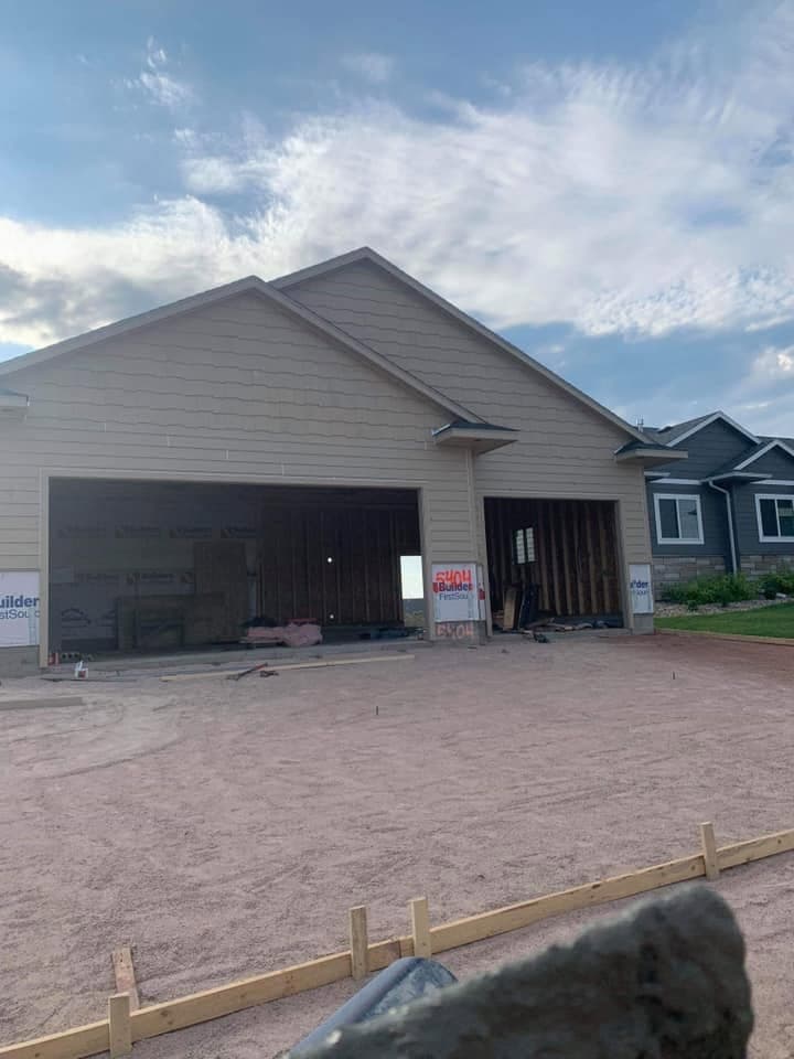 A finished concrete floor and apron at an open garage door